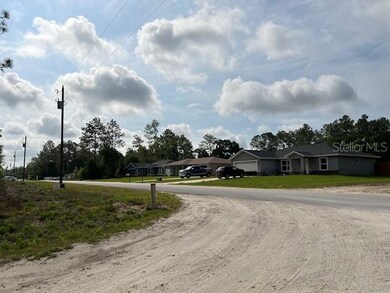 View from side street SW 144th Ct to homes across SW 20 PL from Lot 14