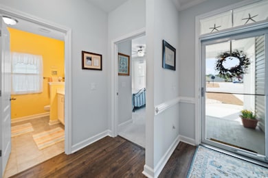 Foyer entrance featuring dark wood-style floors, p
