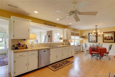 Expansive eat-in kitchen adjoining family room cre