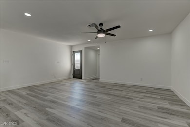 Spare room featuring recessed lighting, light wood-style floors, and ceiling fan