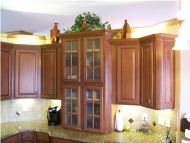 Staggered maple kitchen cabinets