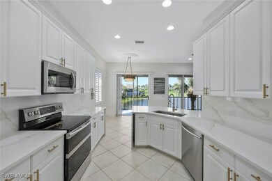 Kitchen with stainless steel appliances, a sink, v