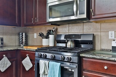 Spacious eat in kitchen area, island, and tons of