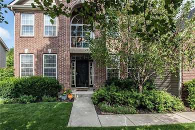 Brick exterior with covered archway and porch