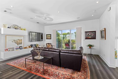 Living area featuring visible vents, baseboards, 