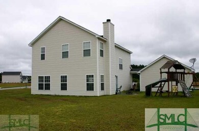 Exterior Back. The swingset does not stay.