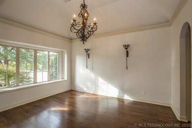 Beautiful window, sconces and chandelier. Hardwood