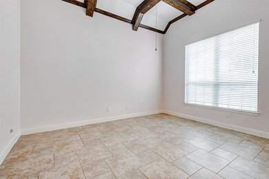 Bright home office with high ceilings featuring ex