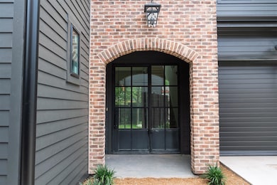 Property entrance with brick siding