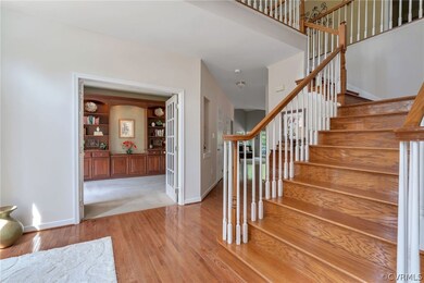 Elegant entrance foyer with turning staircase and