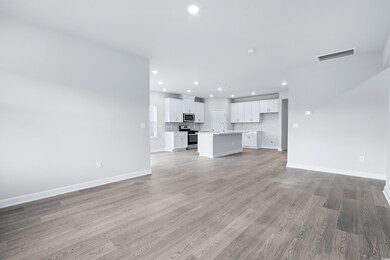 Unfurnished living room featuring recessed lighting and light wood-style flooring