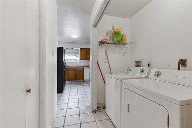 Laundry area near kitchen.