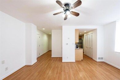 View from living room of kitchen and the hall to t