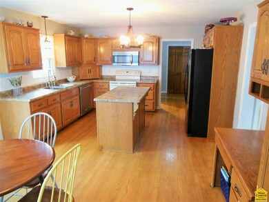 Eat-in kitchen with hardwood floors