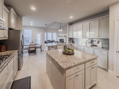 Gourmet kitchen showcasing a tasteful backsplash, 