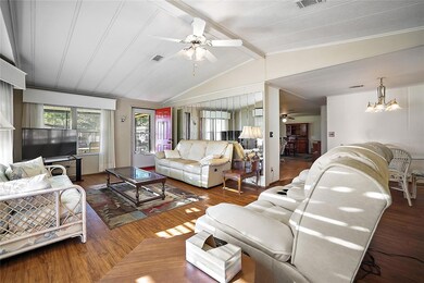 Another view of living room, looking into screened porch