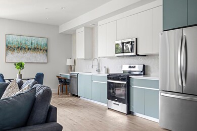 Kitchen featuring stainless steel appliances, ope