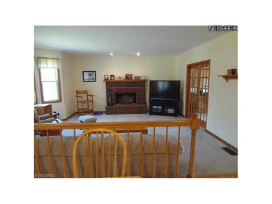 Family room has a bayed window area and a gas igni