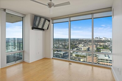 Unfurnished room featuring expansive windows, woo