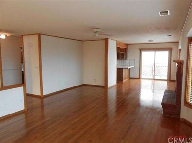 Living room view toward kitchen, dining.