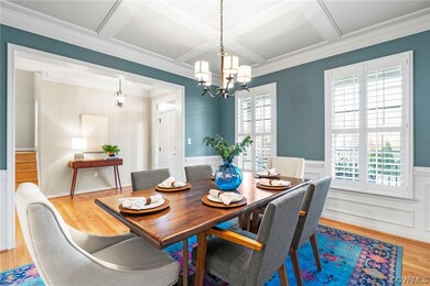 Formal dining room with crown, chair rail, picture