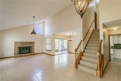 Living Room with wood-burning fireplace, dining ro