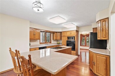 Kitchen view with granite counter tops hardwood fl