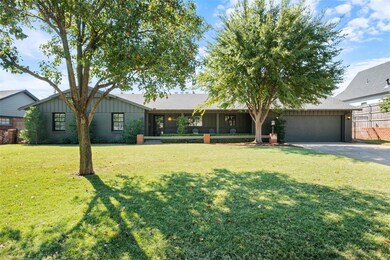 Ranch-style house with a garage and a front yard