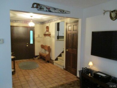 View of main entrance foyer from family room, soli