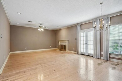 LIVING ROOM WITH COZY FIREPLACE