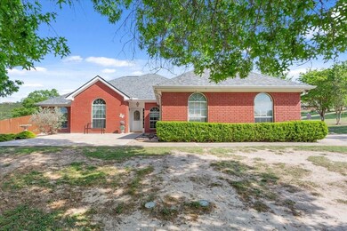 View of front of property with a shingled roof, fe