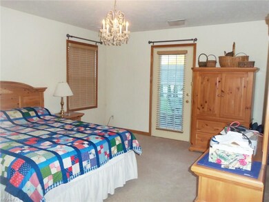 Master bedroom has access to rear patio