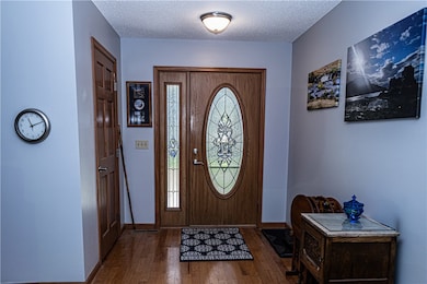 Entry with wood flooring