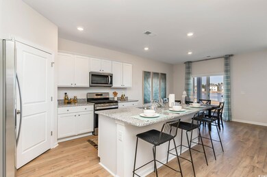 Kitchen with light wood-type flooring, white cabin