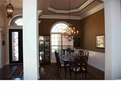 Study has French Doors, Hardwood Floors & Crown Molding