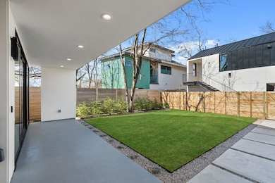 View of yard featuring a fenced backyard and a pa