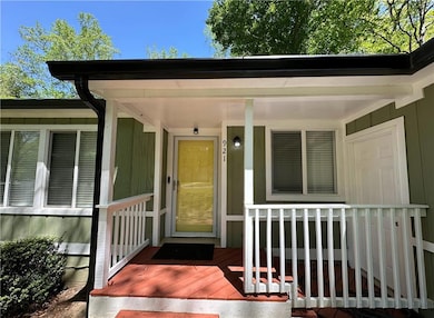Property entrance with covered porch