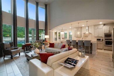 This spacious open-plan living area features high
