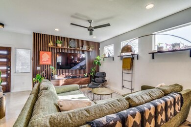 Living area with recessed lighting, a ceiling fan