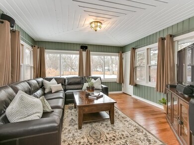 Four season family room with updated hardwood floo