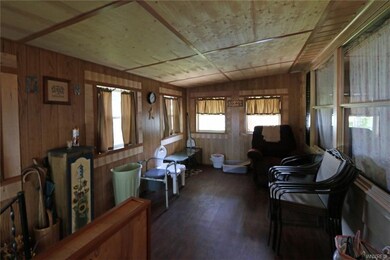 lovely enclosed porch/sunroom to enjoy the breeze,