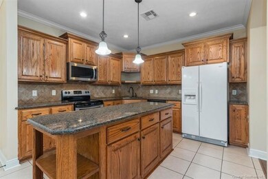 Kitchen  View 1 - Island with storage and shelving