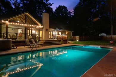 View of pool with a wooden deck