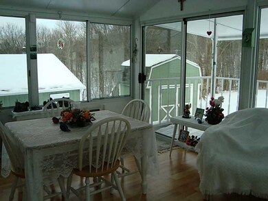 Sunroom. Enjoy the views of the beautiful property