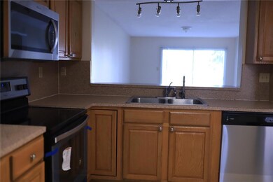 Kitchen overlooking dining and living area