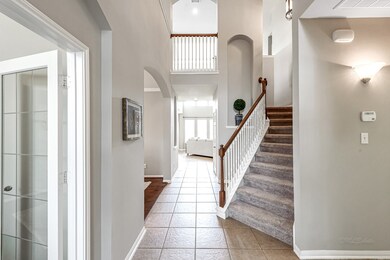 Tile entry, fresh neutral paint and new carpet on the stairs greet you.