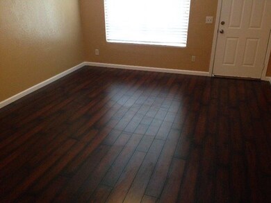 Living room Hardwood flooring and new baseboard