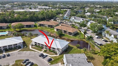 Birds eye view of property with a water view and a