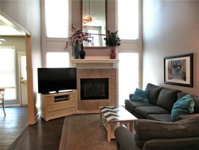 Great Room with Gas Log Fireplace Surrounded by Se