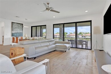 Living area with light wood finished floors, a ceiling fan, and recessed lighting